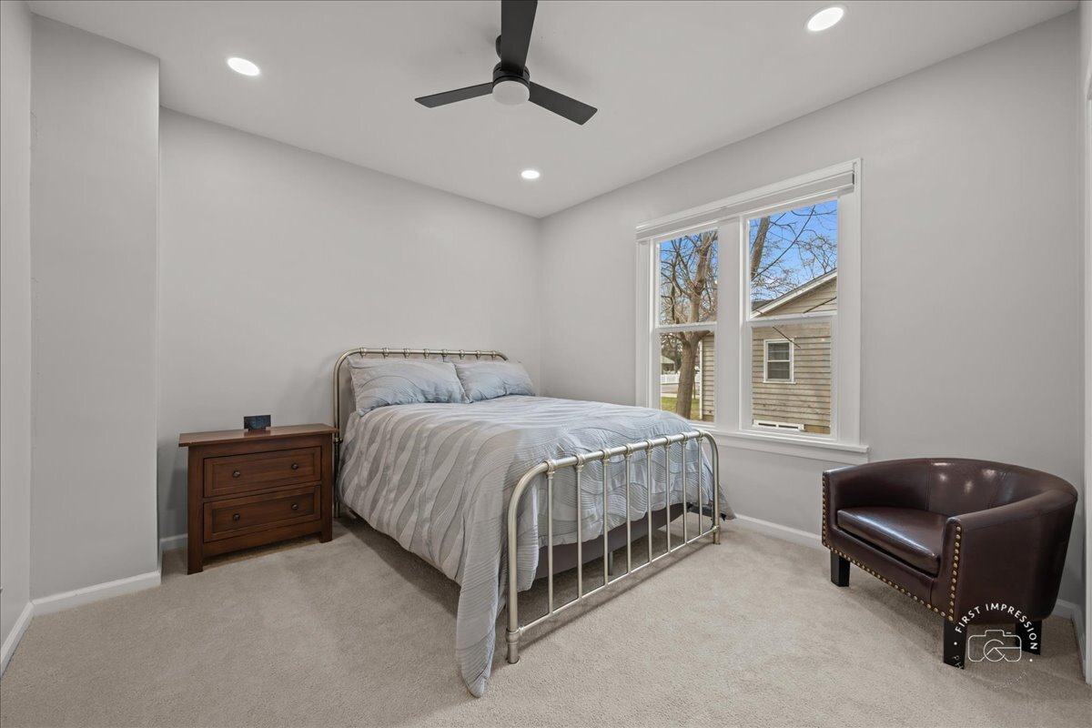 20 Central Avenue Aurora, IL 60506 - Photo 13 of 22 a spacious bedroom with a bed and furniture