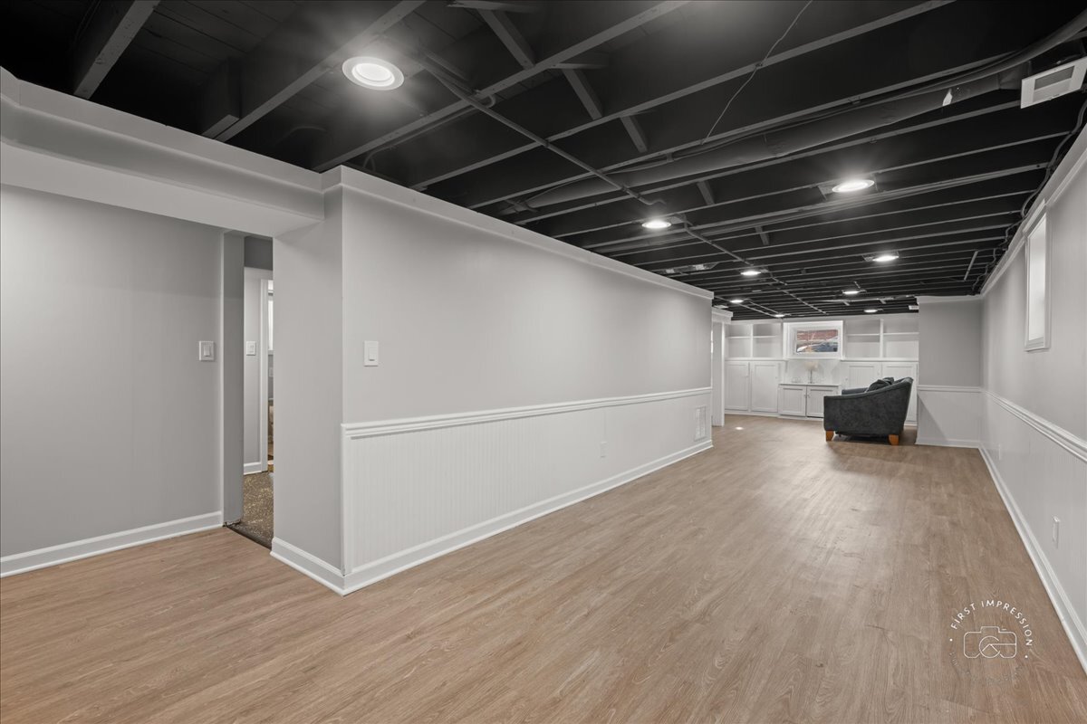 20 Central Avenue Aurora, IL 60506 - Photo 19 of 22 a view of an empty room with wooden floor