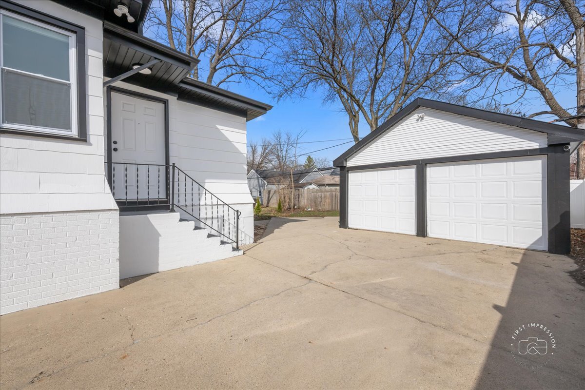 20 Central Avenue Aurora, IL 60506 - Photo 22 of 22 a view of a house with a snow in the yard