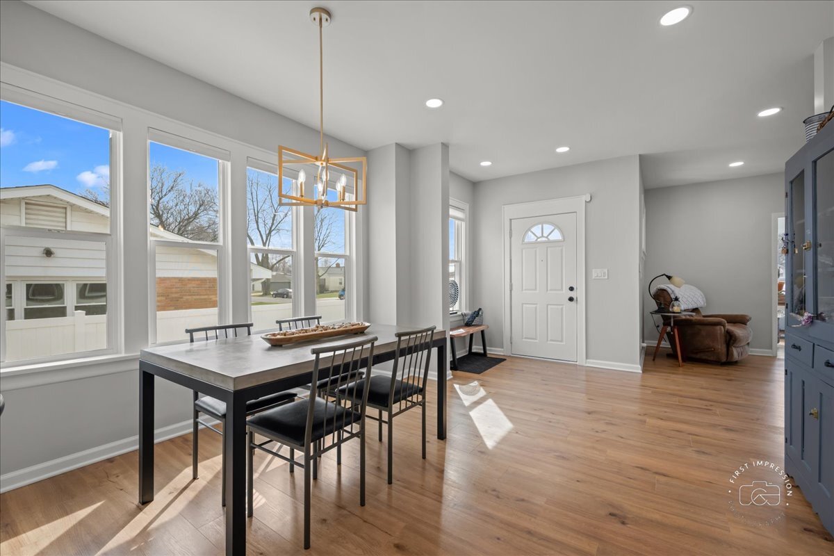 20 Central Avenue Aurora, IL 60506 - Photo 8 of 22 a view of a a dining room with furniture window and wooden floor