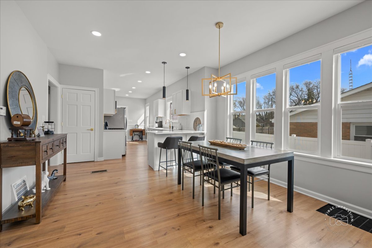 20 Central Avenue Aurora, IL 60506 - Photo 9 of 22 a view of a dining room with furniture window and wooden floor