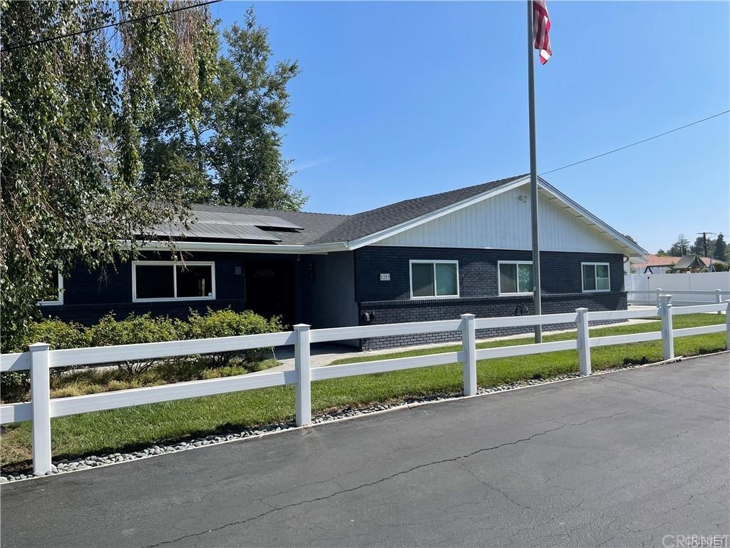 5259 Lewis Road Agoura Hills, CA 91301 - Photo 2 of 39 a front view of a house with a yard