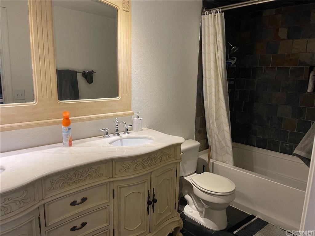 5259 Lewis Road Agoura Hills, CA 91301 - Photo 12 of 39 a bedroom with a bed and window