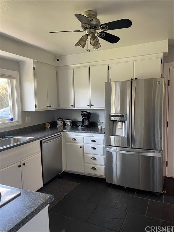 5259 Lewis Road Agoura Hills, CA 91301 - Photo 26 of 39 a kitchen with a stove and a refrigerator
