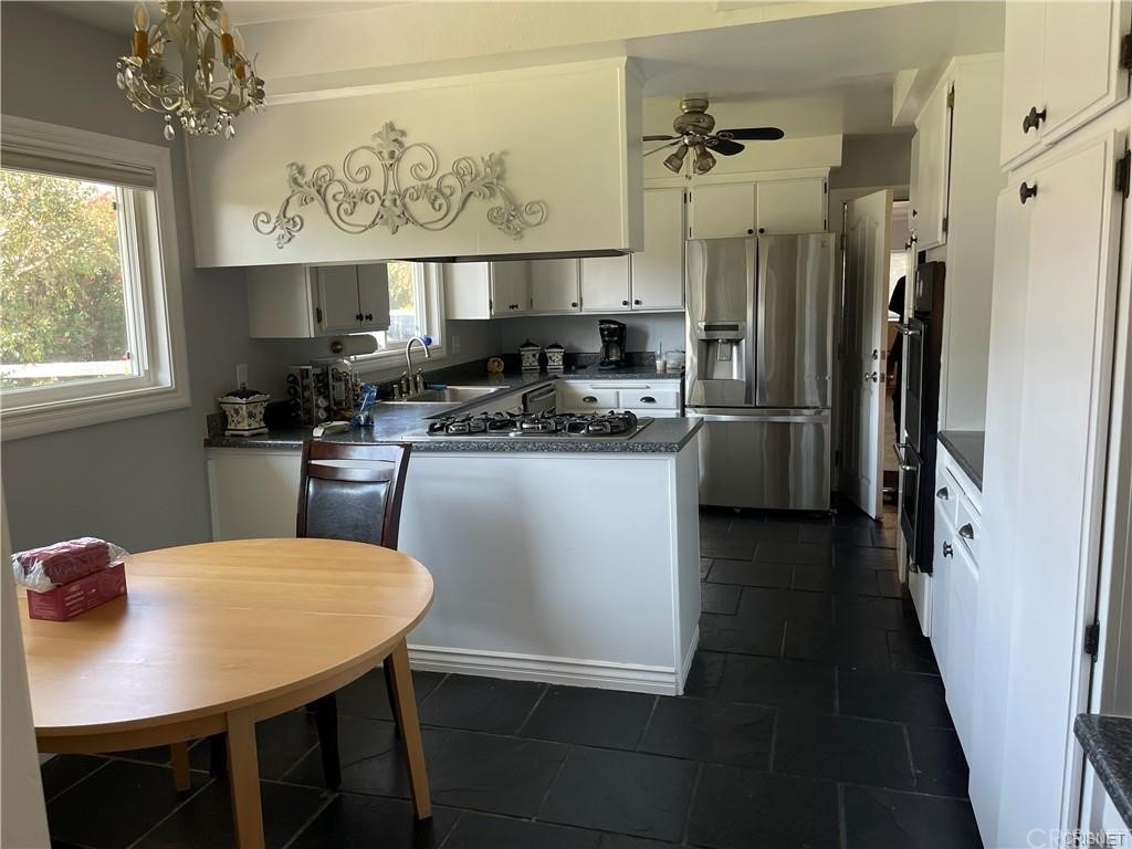 5259 Lewis Road Agoura Hills, CA 91301 - Photo 28 of 39 a view of a dining room with furniture