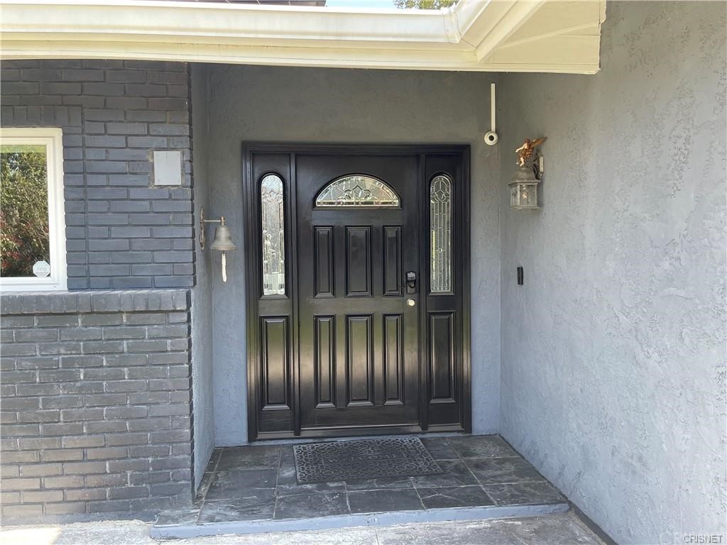 5259 Lewis Road Agoura Hills, CA 91301 - Photo 32 of 39 a front view of a house with a yard