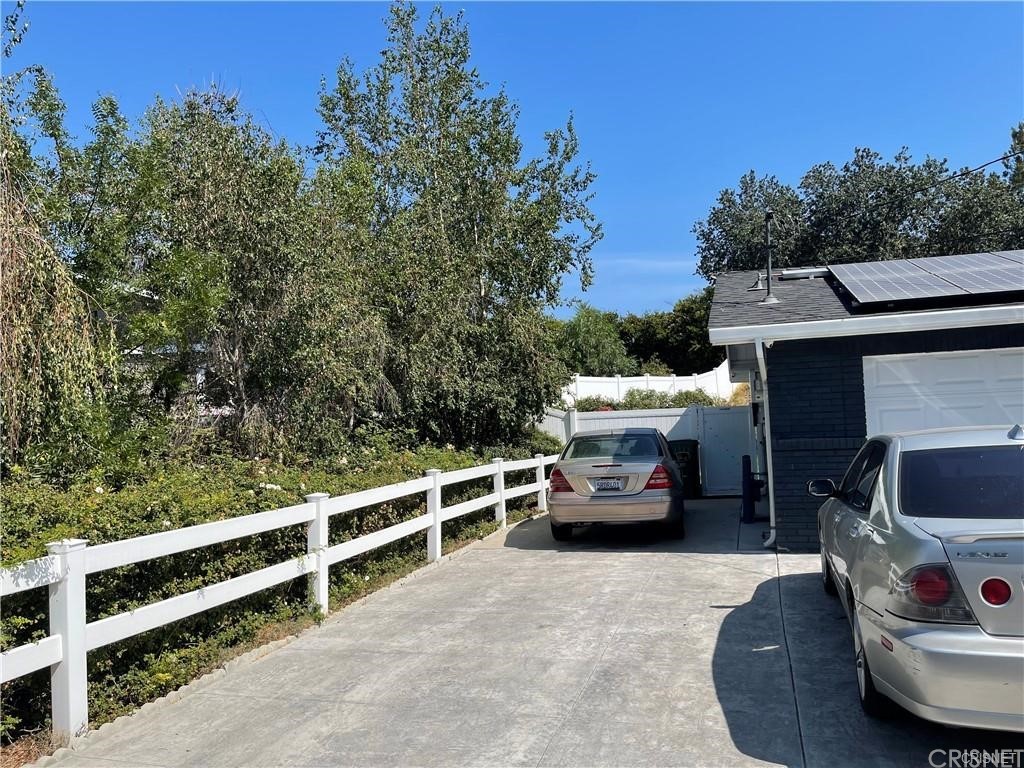 5259 Lewis Road Agoura Hills, CA 91301 - Photo 35 of 39 a front view of a house with a yard