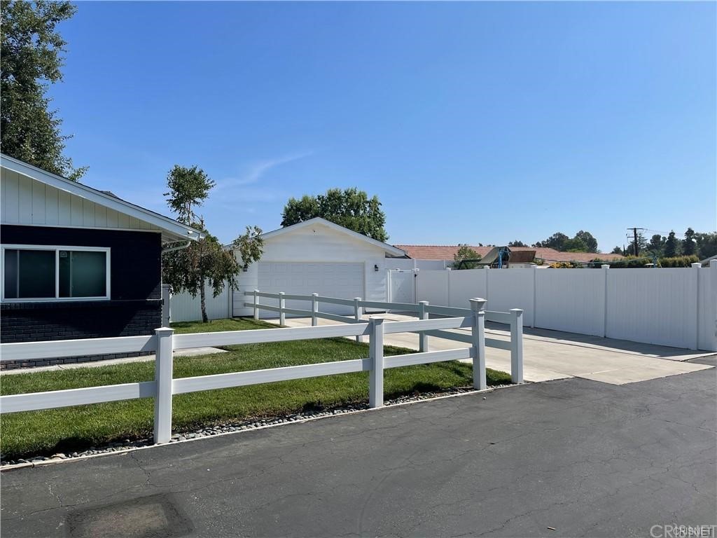 5259 Lewis Road Agoura Hills, CA 91301 - Photo 37 of 39 a front view of a house with garden