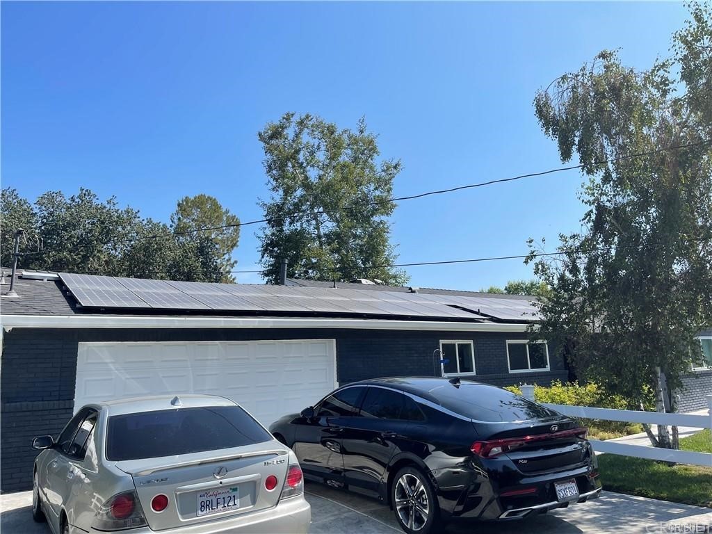 5259 Lewis Road Agoura Hills, CA 91301 - Photo 7 of 39 a room with gym equipment and a chandelier