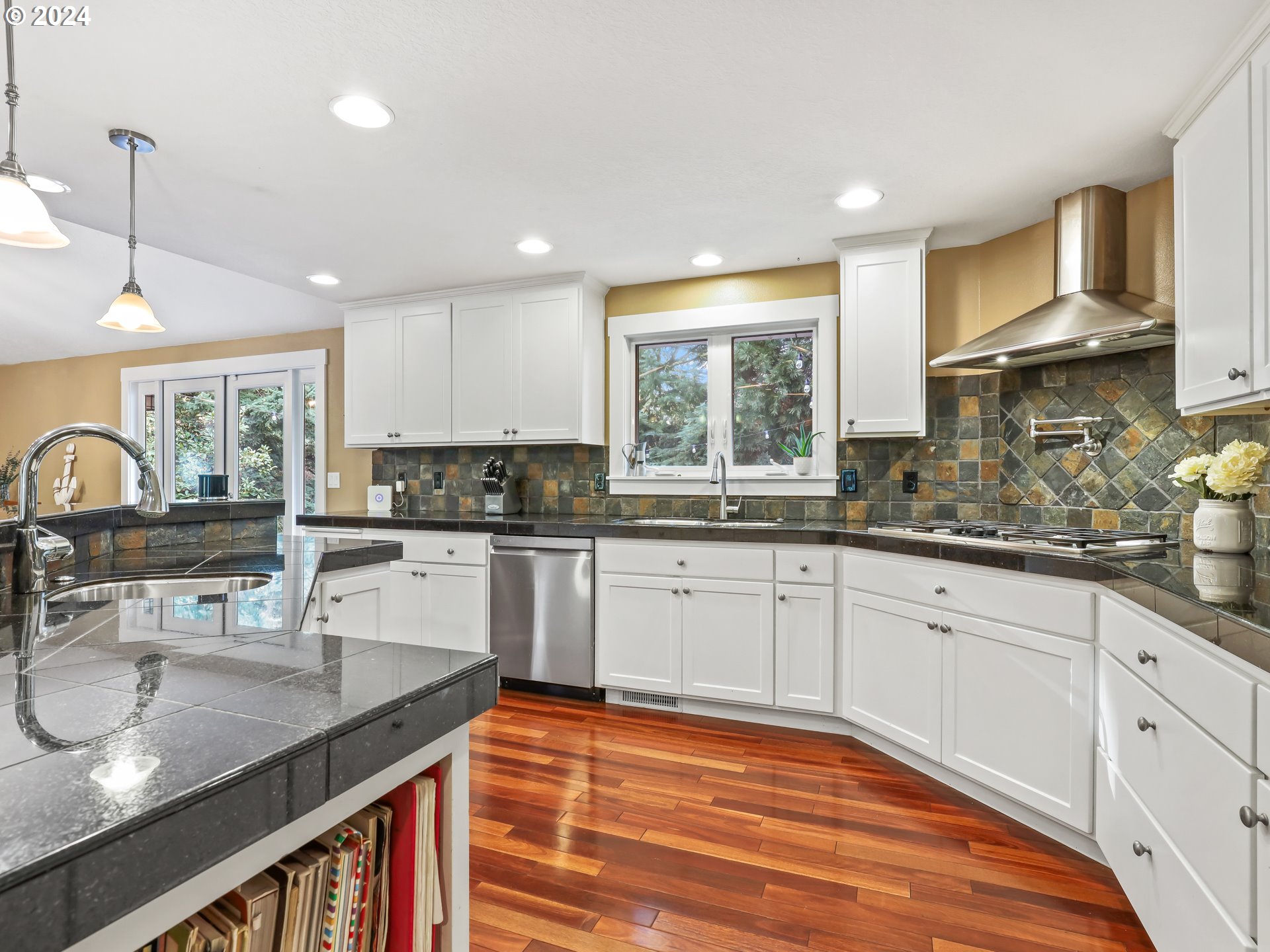 16787 Southeast Tong Road Damascus, OR 97089 - Photo 15 of 47 a kitchen with stainless steel appliances granite countertop a sink a stove and a wooden cabinets