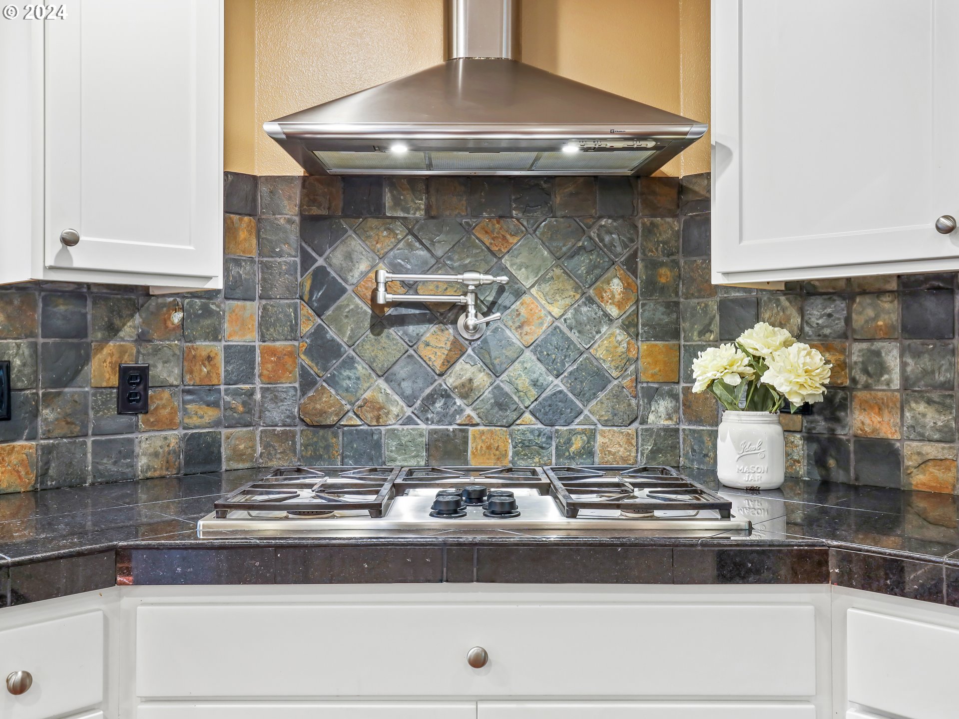 16787 Southeast Tong Road Damascus, OR 97089 - Photo 16 of 47 a close view of stove with granite counter top