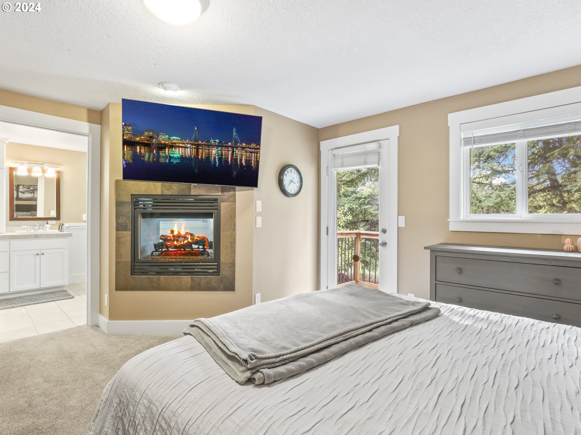 16787 Southeast Tong Road Damascus, OR 97089 - Photo 19 of 47 a bedroom with a bed and a large window with balcony view
