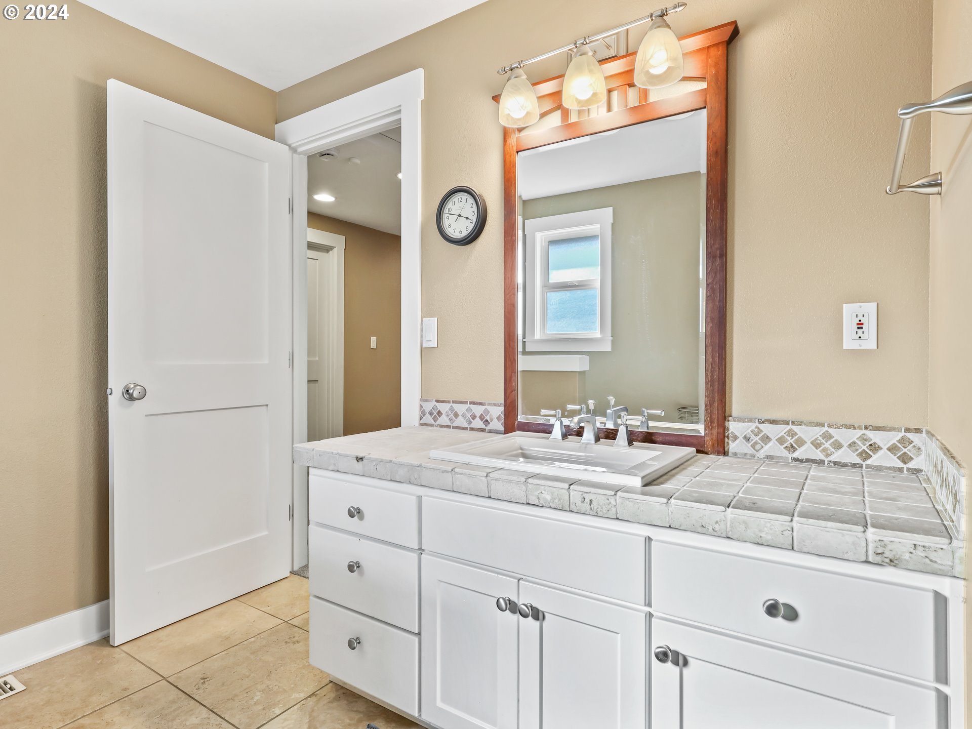 16787 Southeast Tong Road Damascus, OR 97089 - Photo 26 of 47 a bathroom with a sink and a mirror