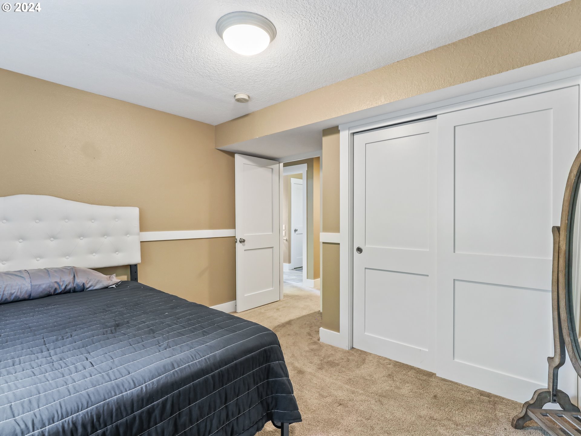 16787 Southeast Tong Road Damascus, OR 97089 - Photo 28 of 47 a bedroom with a bed and a cabinets