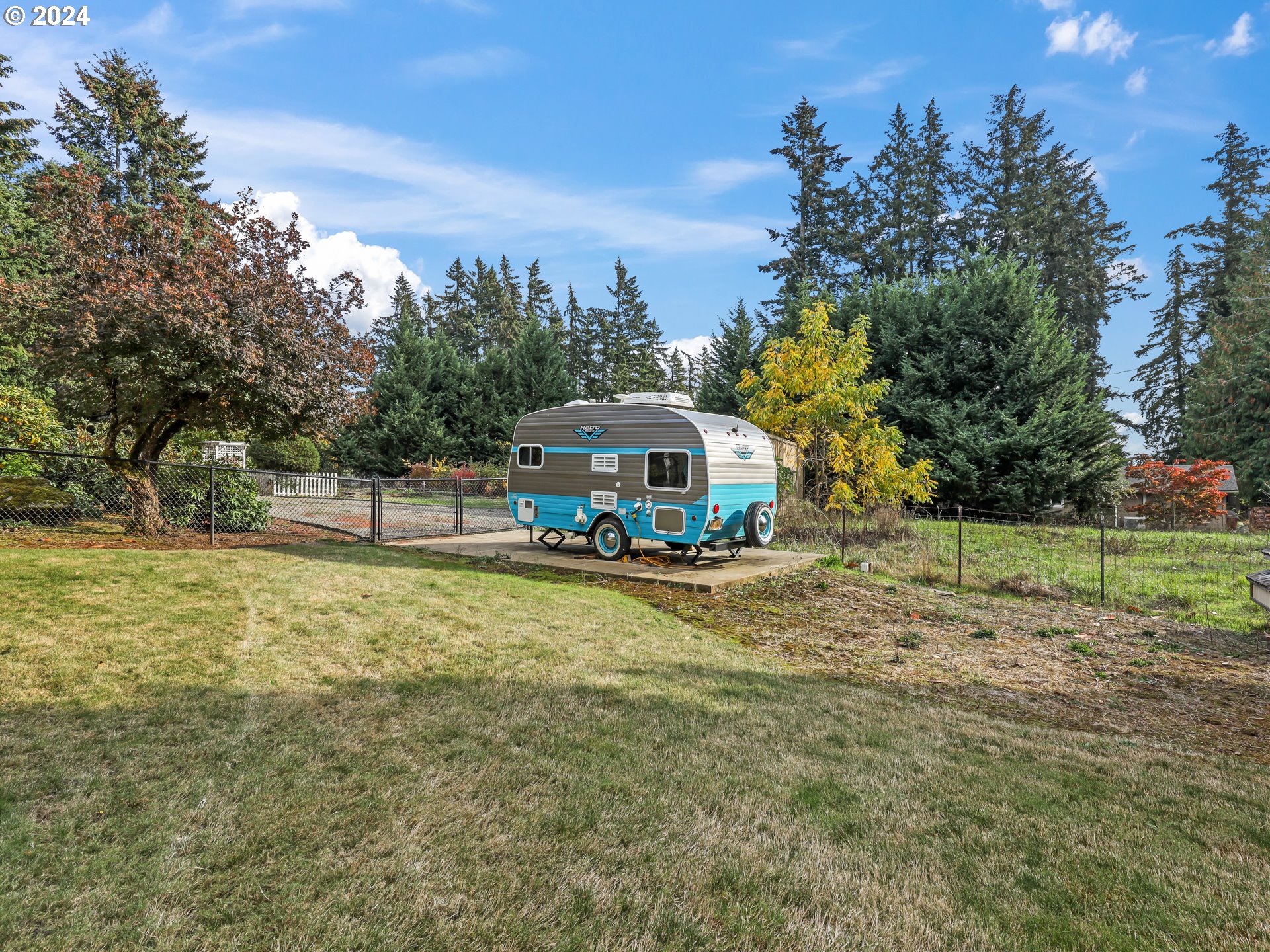 16787 Southeast Tong Road Damascus, OR 97089 - Photo 40 of 47 a yellow house with trees in front of it