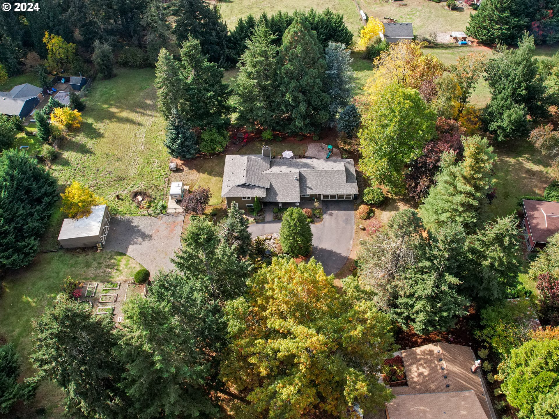 16787 Southeast Tong Road Damascus, OR 97089 - Photo 42 of 47 an aerial view of a house with a yard and lake view