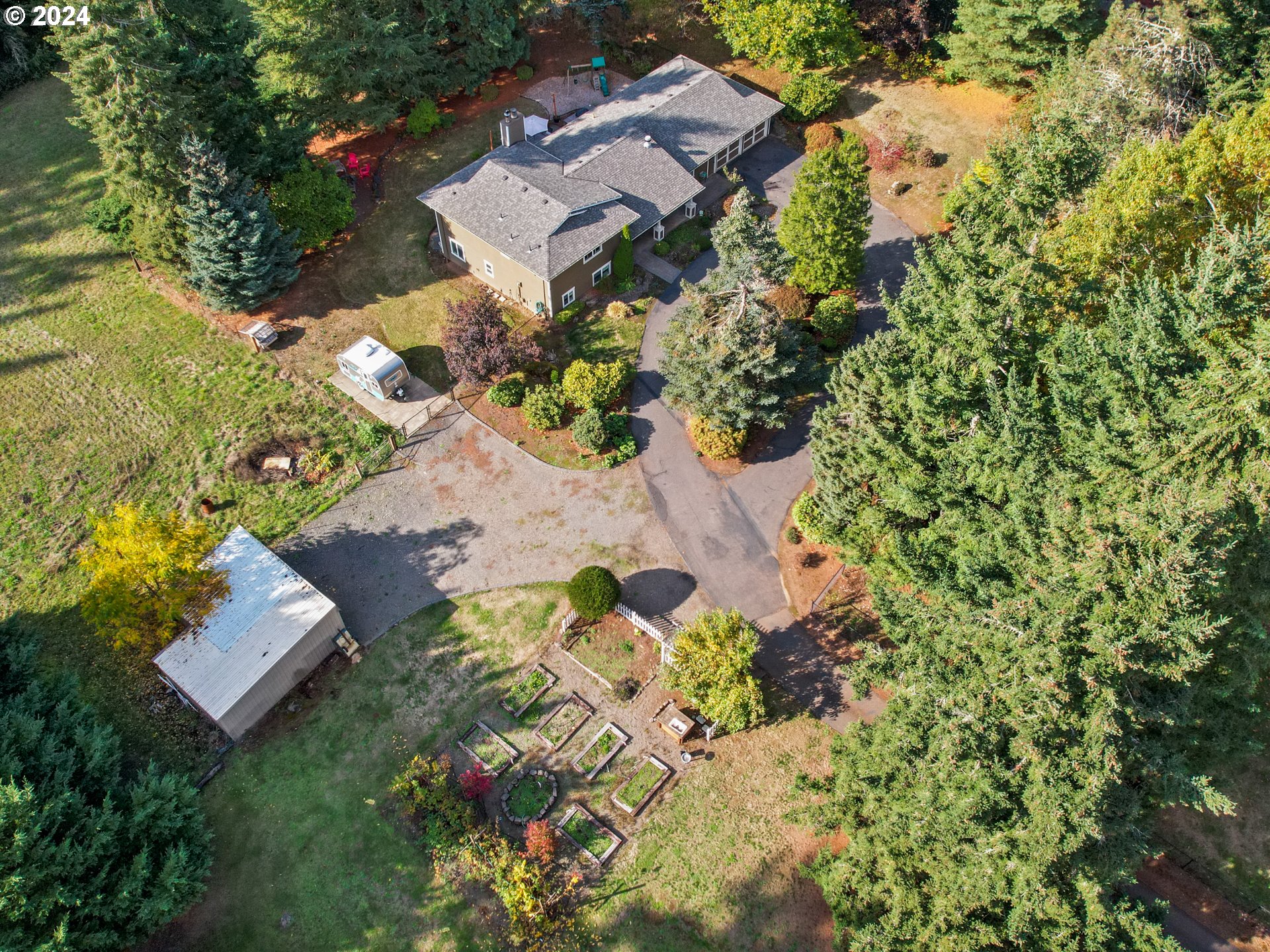 16787 Southeast Tong Road Damascus, OR 97089 - Photo 45 of 47 an aerial view of residential house with yard and swimming pool