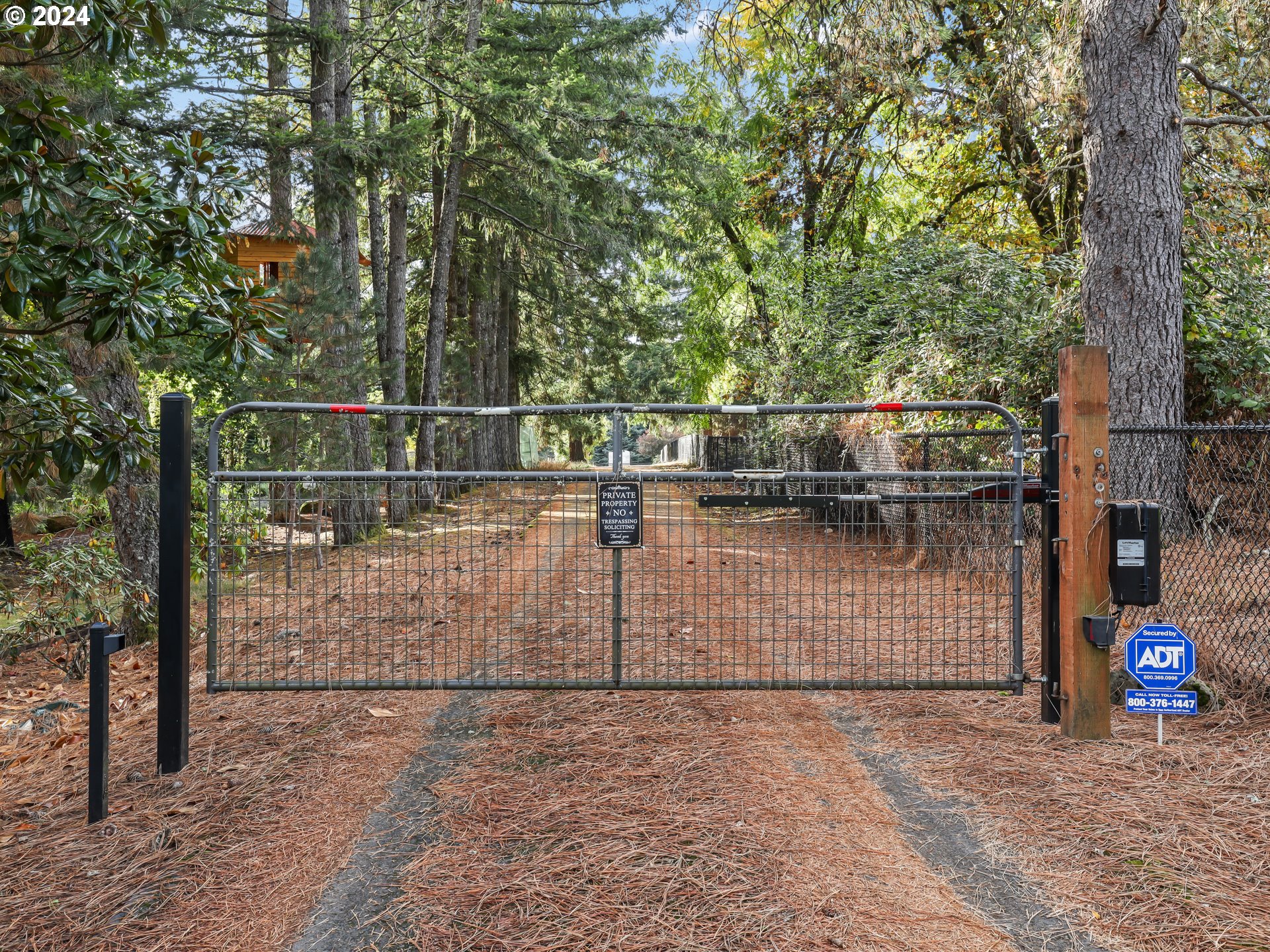 16787 Southeast Tong Road Damascus, OR 97089 - Photo 46 of 47 a view of a parking space with wooden fence