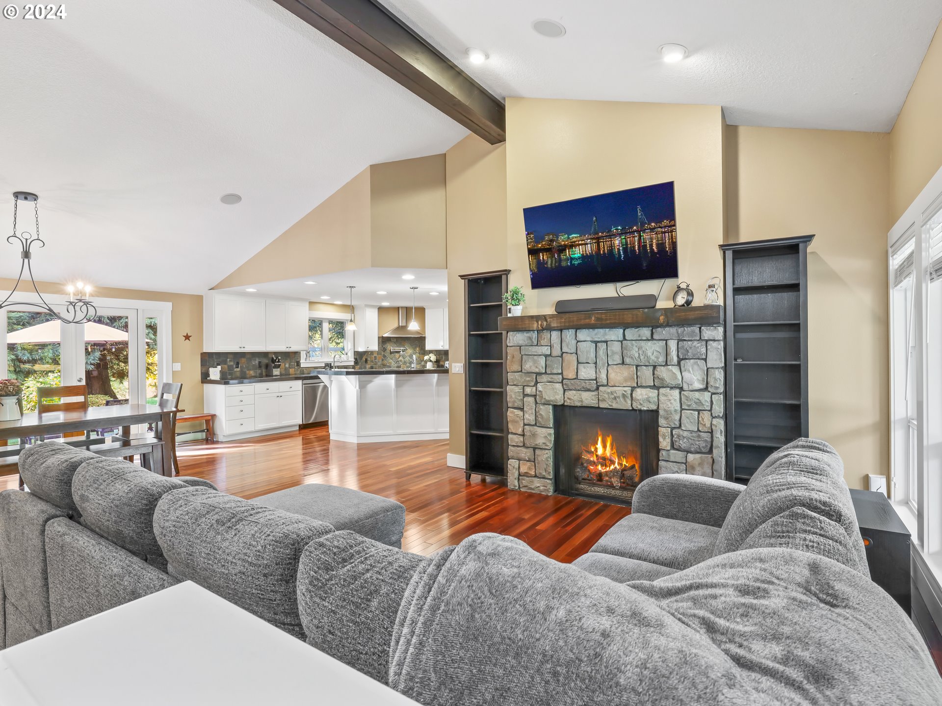 16787 Southeast Tong Road Damascus, OR 97089 - Photo 6 of 47 a living room with furniture fireplace and flat screen tv