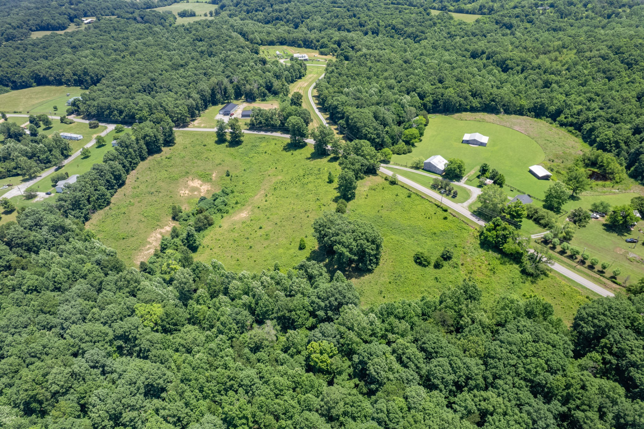 0 Mobley Ridge Road Duck River, TN 38454 - Photo 7 of 35 an aerial view of a house with a yard and lake view