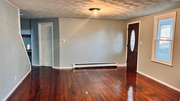 34 Border Street Springfield, MA 01104 - Photo 15 of 20 an empty room with wooden floor and a window