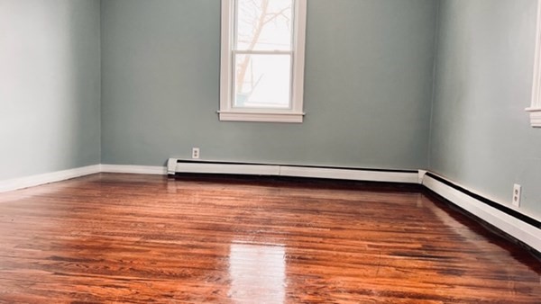 34 Border Street Springfield, MA 01104 - Photo 20 of 20 a view of empty room with wooden floor