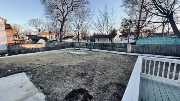 34 Border Street Springfield, MA 01104 - Photo 4 of 20 a view of a yard with wooden fence