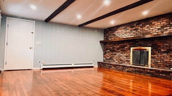 34 Border Street Springfield, MA 01104 - Photo 10 of 20 an empty room with wooden floor