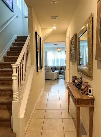 a lobby with furniture and stairs