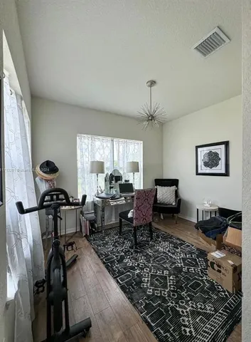 a living room with furniture or couch and a table