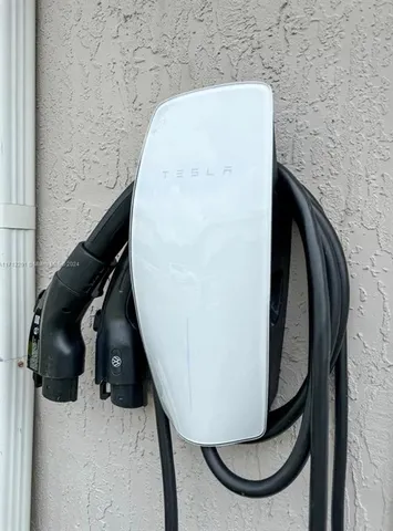 a view of house with outdoor space and swimming pool