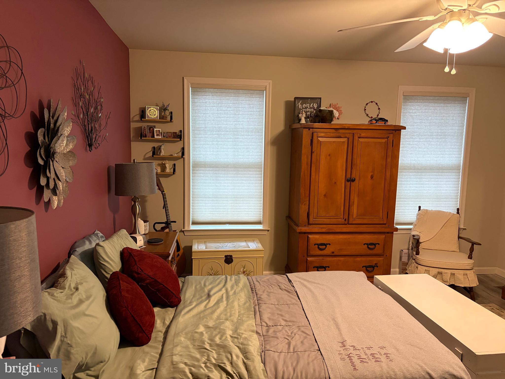 74 Emily Court Reading, PA 19606 - Photo 24 of 31 a bedroom with a bed and a chandelier