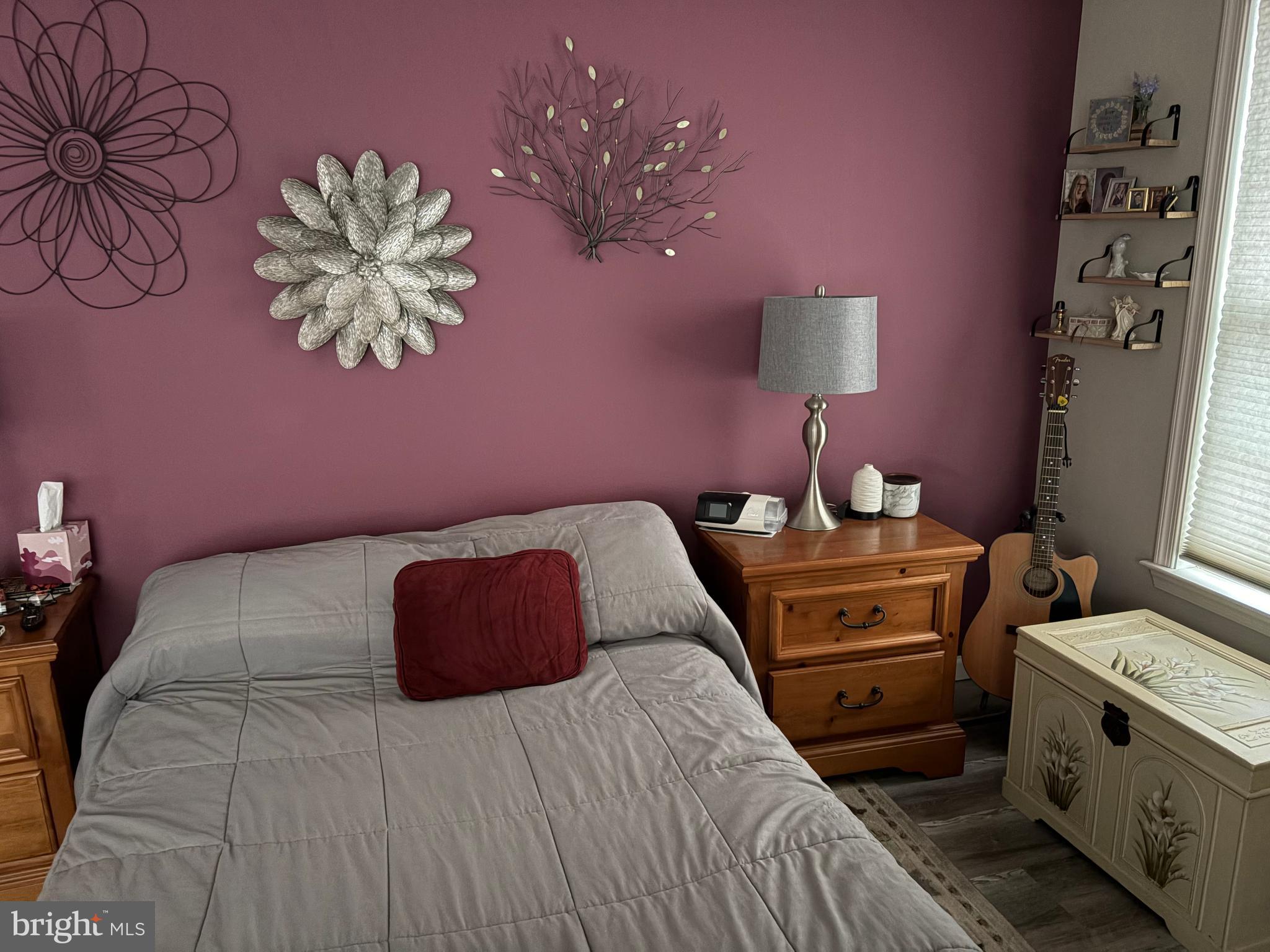 74 Emily Court Reading, PA 19606 - Photo 25 of 31 a bedroom with a bed and a chandelier