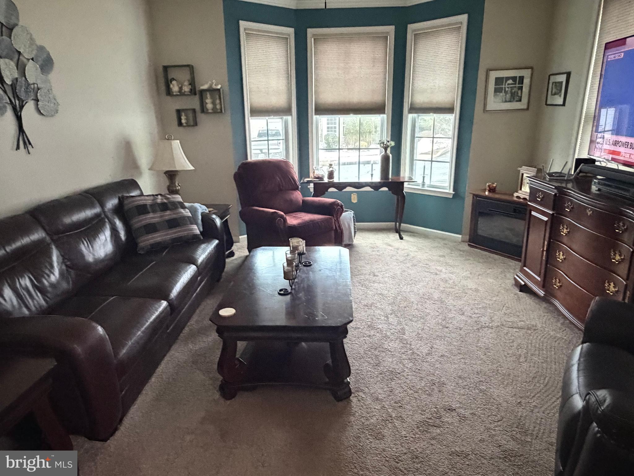 74 Emily Court Reading, PA 19606 - Photo 3 of 31 a living room with furniture rug and window
