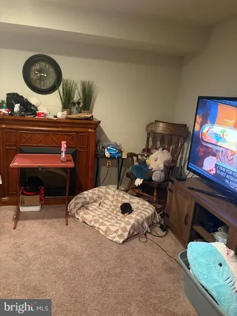 a living room with furniture and a chair