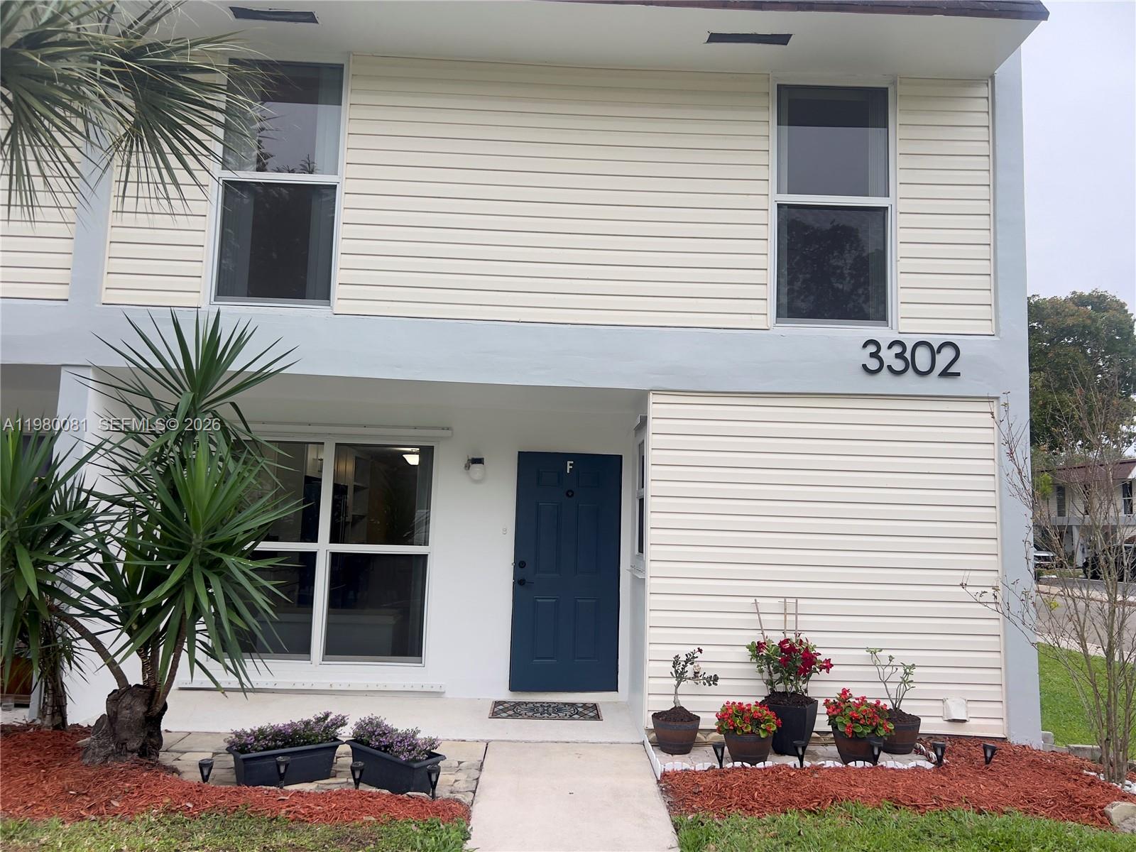 3302 Farragut Street, Unit 5F Hollywood, FL 33021 - Photo 1 of 11 a front view of a house with a yard