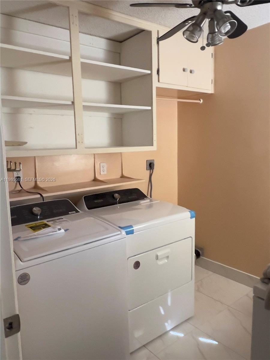 3302 Farragut Street, Unit 5F Hollywood, FL 33021 - Photo 6 of 11 a utility room with dryer and washer