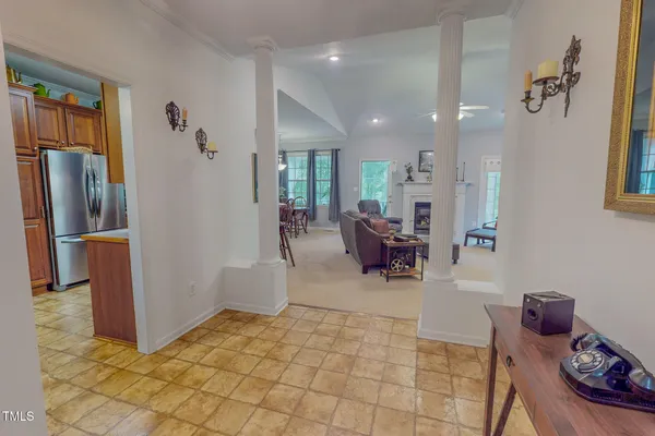 a kitchen with refrigerator and cabinets
