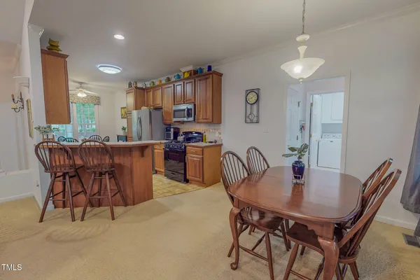 a view of a dining room with furniture