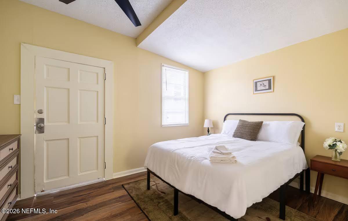 1438 Dancy Street Jacksonville, FL 32205 - Photo 16 of 49 a bedroom with a bed and a window