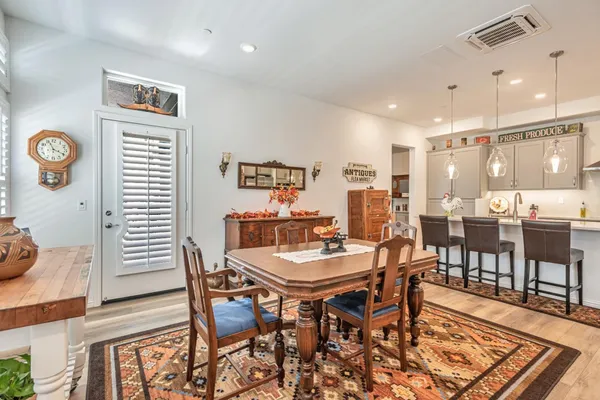 a dining room with a table and chairs