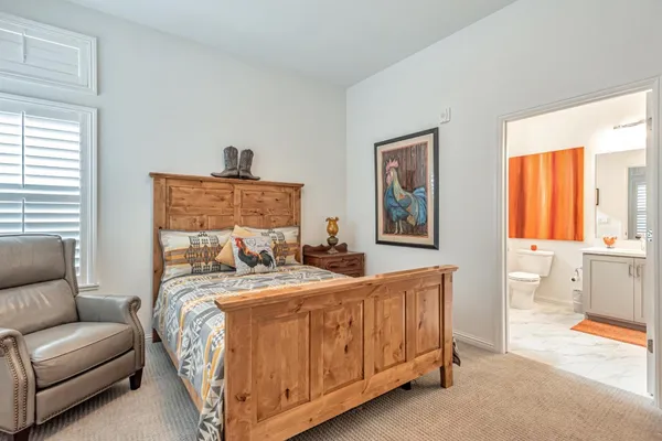 a bedroom with a bed and a couch