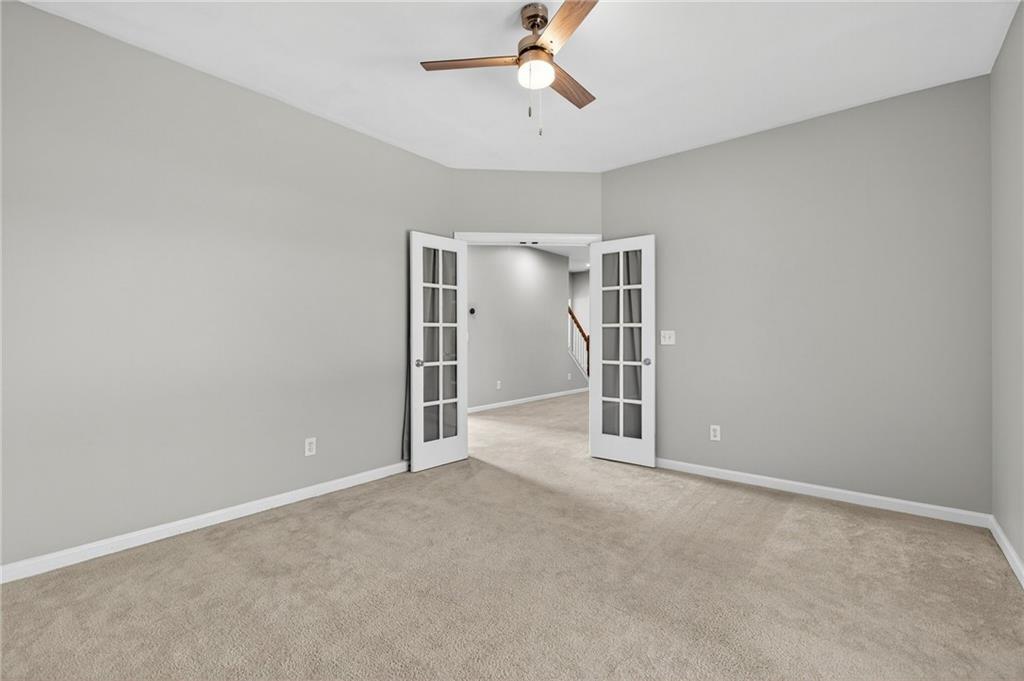 103 Forest Creek Way Canton, GA 30115 - Photo 18 of 55 a view of empty room with ceiling fan
