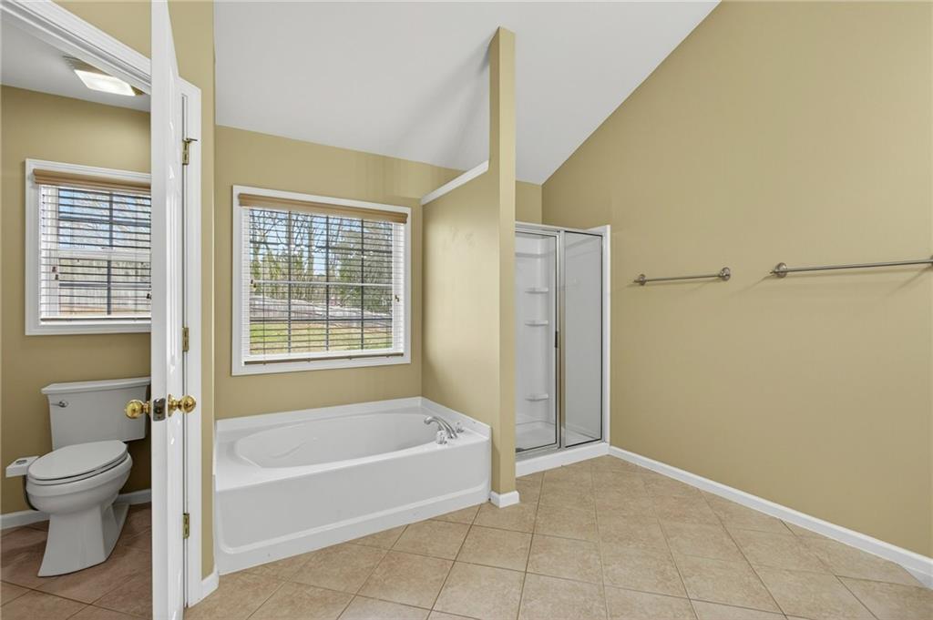 103 Forest Creek Way Canton, GA 30115 - Photo 34 of 55 a spacious bathroom with a bathtub and toilet