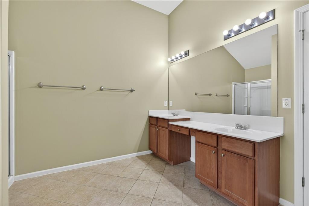 103 Forest Creek Way Canton, GA 30115 - Photo 35 of 55 a bathroom with a sink and a mirror