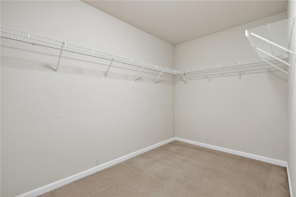 103 Forest Creek Way Canton, GA 30115 - Photo 37 of 55 a view of a room with racks on the wall