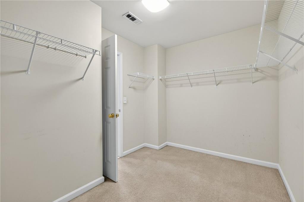 103 Forest Creek Way Canton, GA 30115 - Photo 38 of 55 a view of a room with racks on the wall