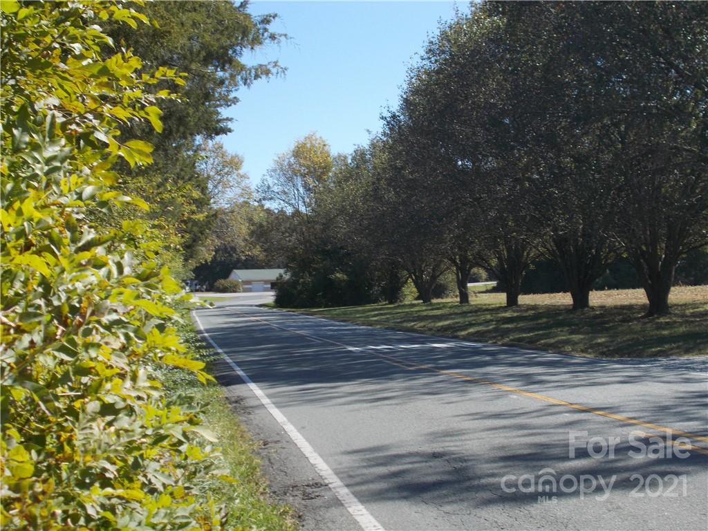 109 Brief Road West Fairview, NC 28079 - Photo 6 of 16 a view of a yard with plants and trees