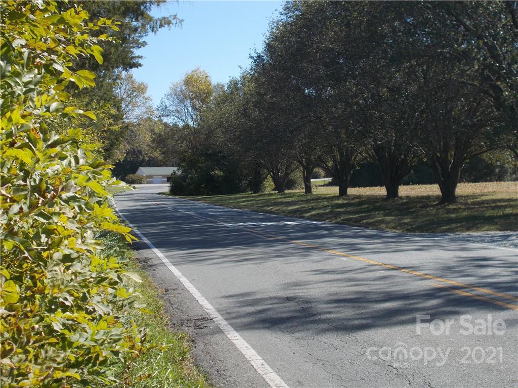 109 Brief Road West Fairview, NC 28079 - Photo 7 of 16 a view of a yard with tree s