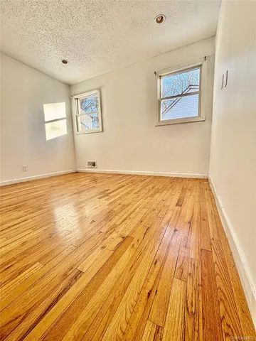 a kitchen with stainless steel appliances a sink a stove a microwave a refrigerator and cabinets